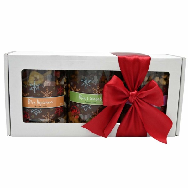 Set of nuts in cans in a gift box with a bow