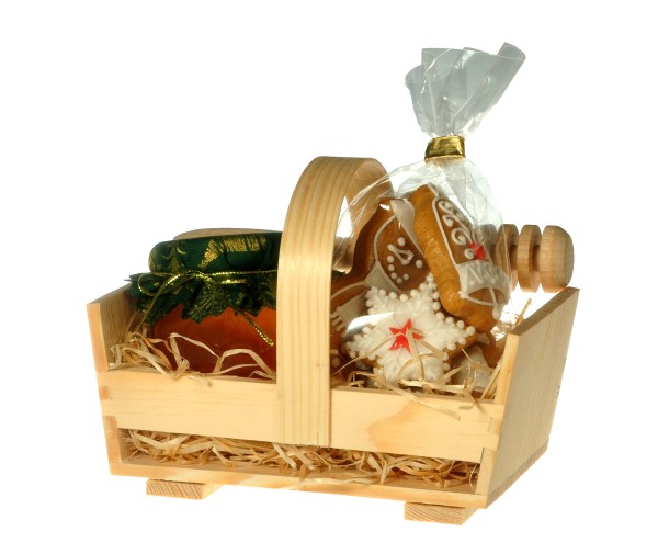 Wooden basket with honey and gingerbread