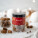 A jar of almonds in milk chocolate and cinnamon
