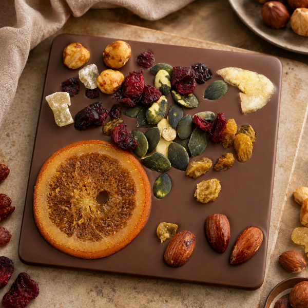 Milk chocolate decorated with dried fruits and nuts
