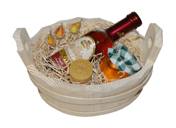 Set of nuts in honey with mead and a candle in a wooden bucket