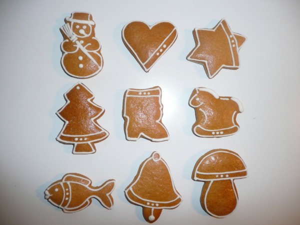Small decorated home-made Christmas gingerbread, individually wrapped in cellophane