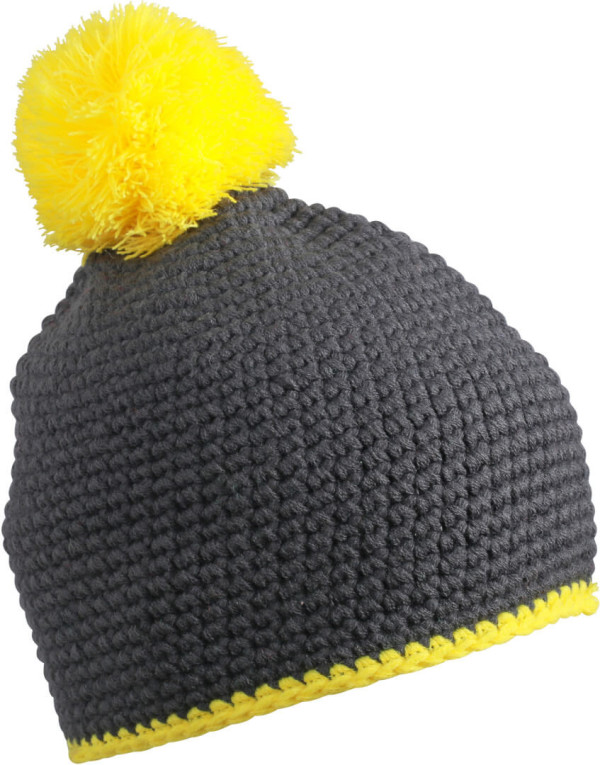 Crocheted hat with contrasting border and pompon
